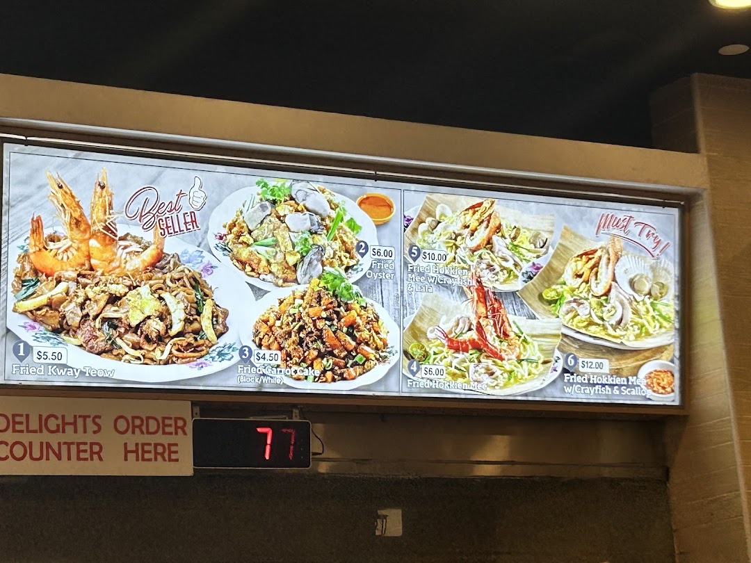 Menu board displaying various Asian dishes with prices and images.