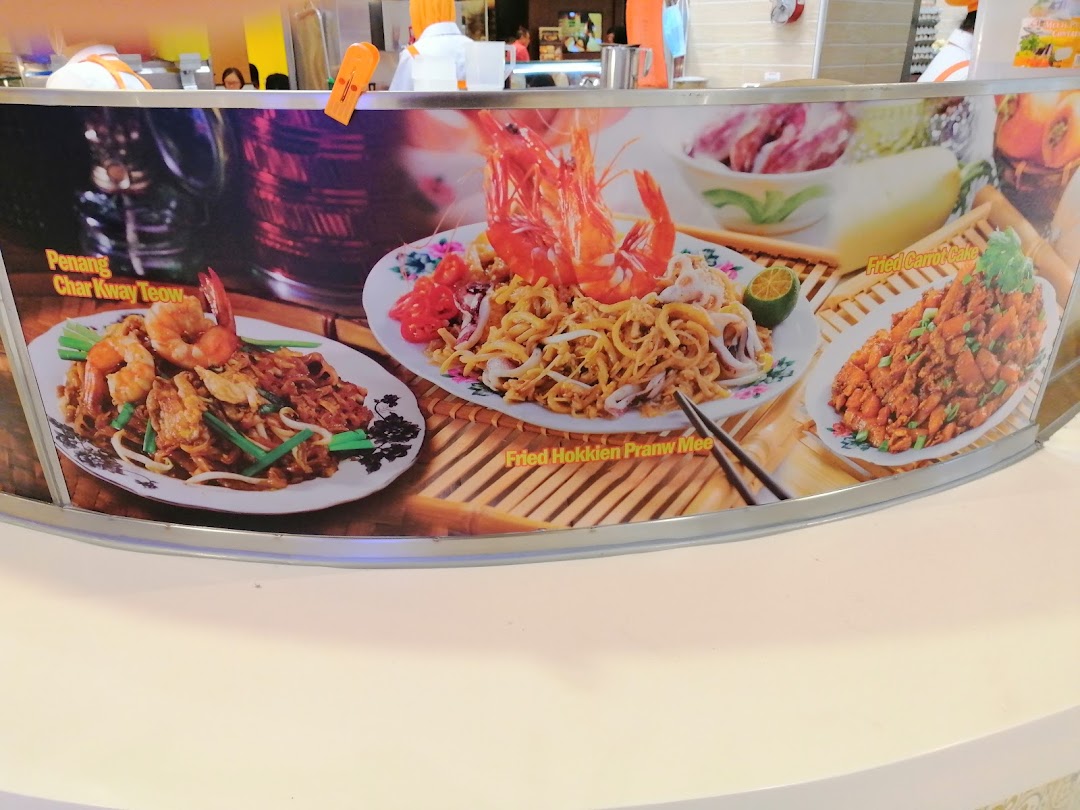 A display board showcasing Encik Tan's popular local dishes: Char Kway Teow, Hokkien Prawn Mee, and Fried Carrot Cake.