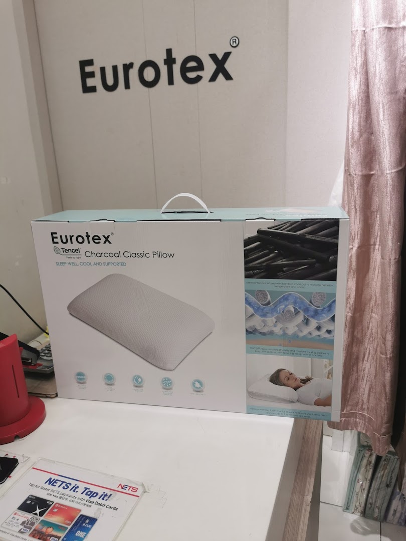 A Eurotex pillow box on a counter inside the shop with brand logo visible.
