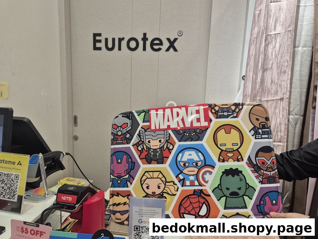 Interior shot of Eurotex shop with Marvel product and checkout counter.