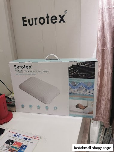 A boxed Eurotex pillow product displayed on a counter inside the shop.