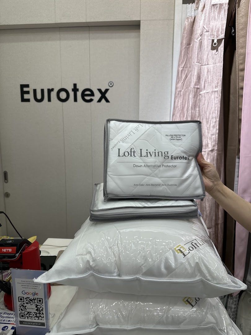 Pillows and bedding products displayed inside a Eurotex shop.