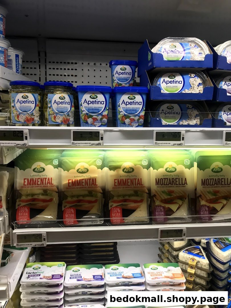 Shelves stocked with various cheese and dairy products in a supermarket.