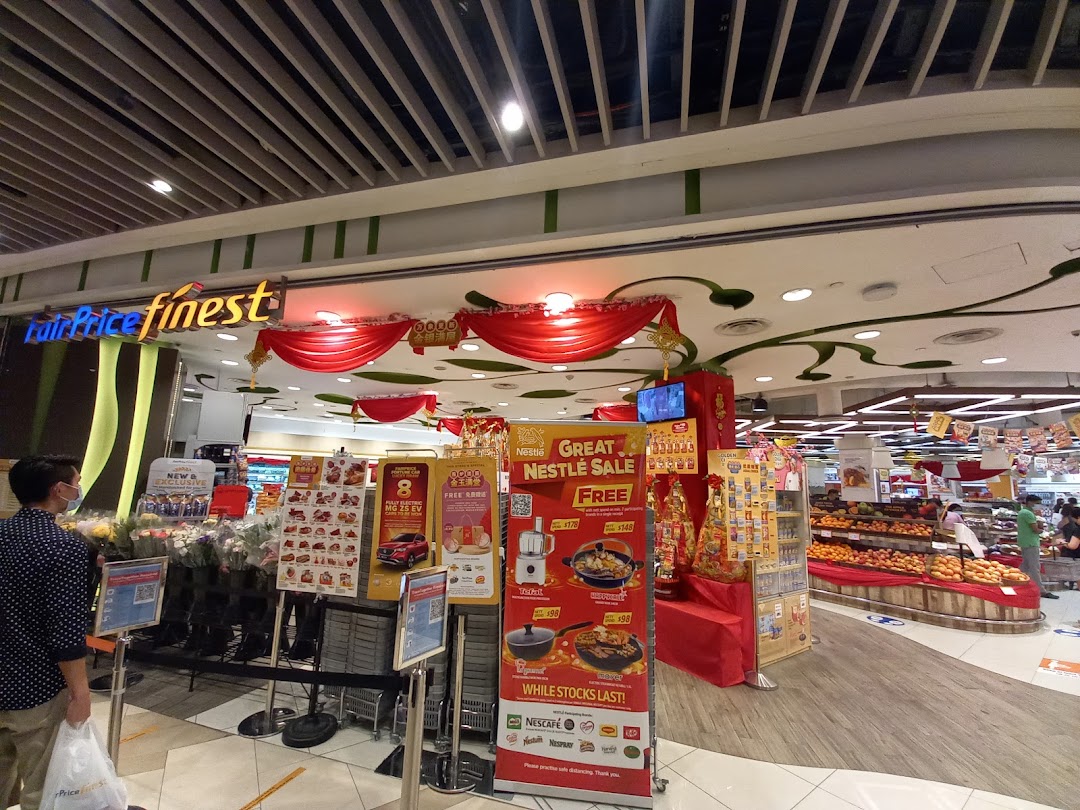 FairPrice Finest supermarket entrance with festive decorations and promotional displays.