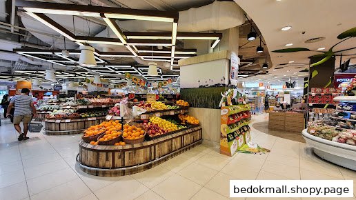 Interior view of a supermarket with fresh fruits and vegetables on display.