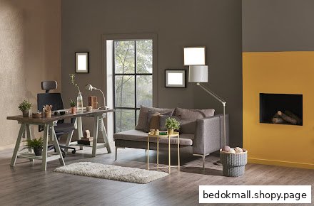 Interior room with a desk, sofa, fireplace, and large window.