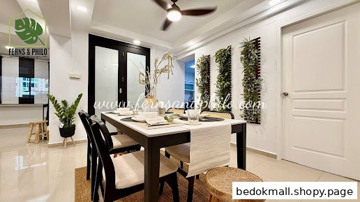 Interior shot of a dining area with a table, chairs, and vertical plant decor.