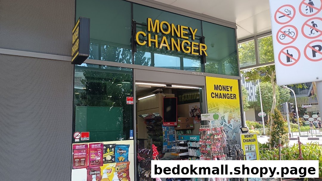 Exterior view of a Money Changer shop with signage and outdoor displays.