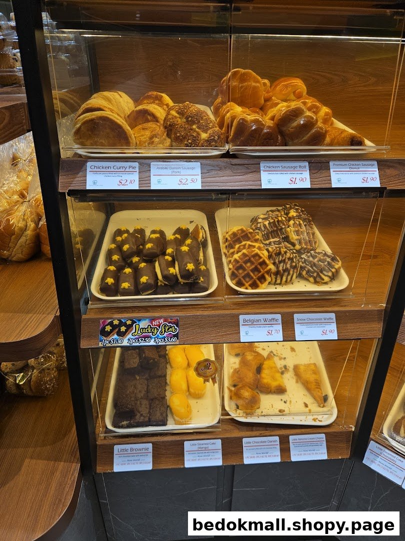 Glass display case filled with various pastries and baked goods.