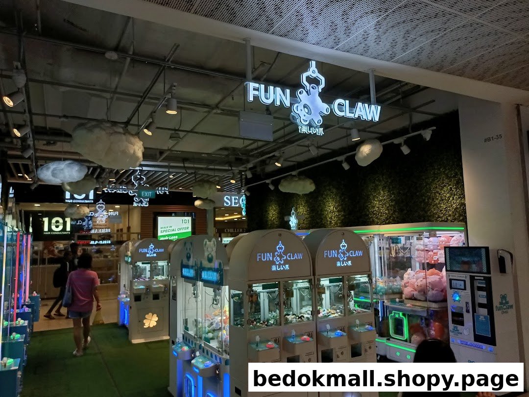 Interior view of Fun Claw arcade with multiple claw machines and people.