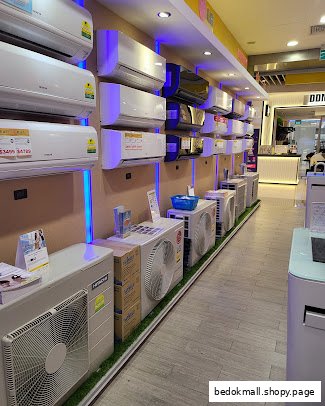 Interior view of a shop displaying many air conditioning units.