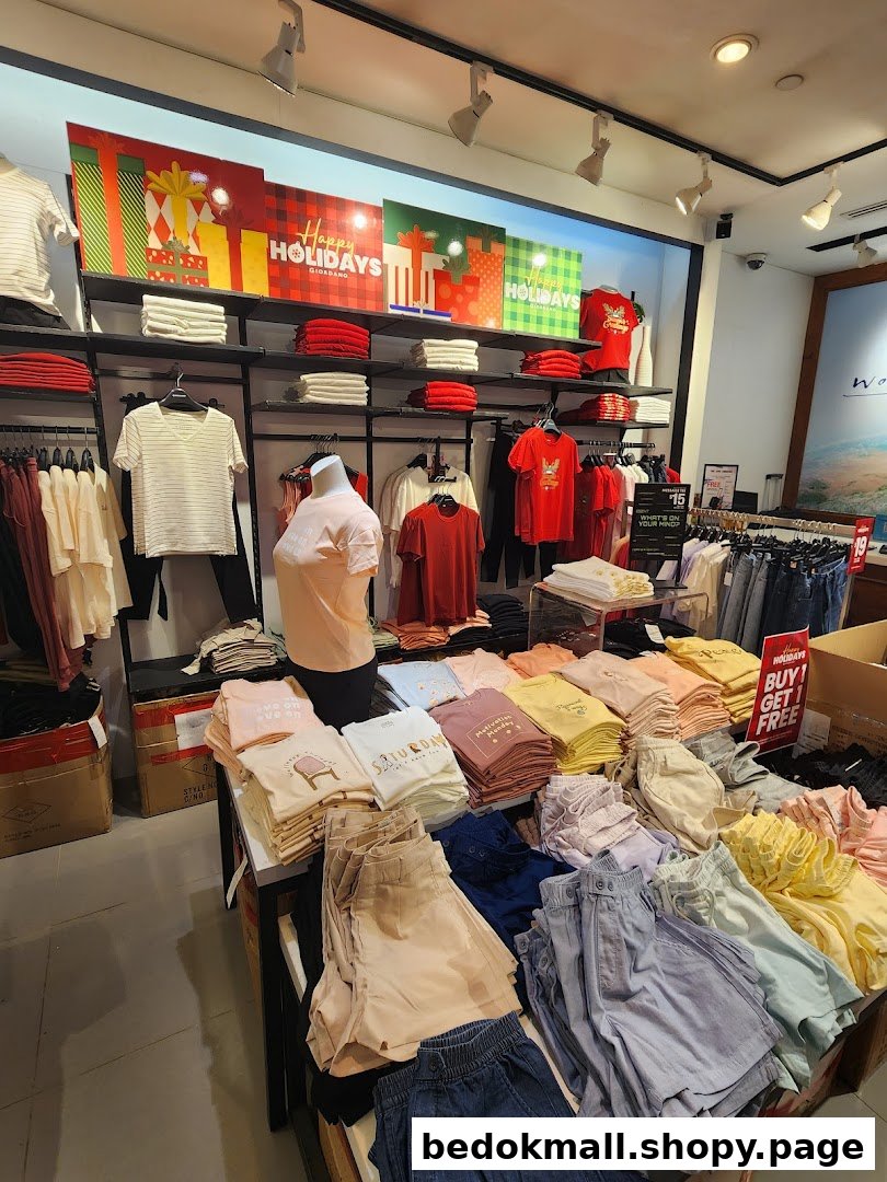 Inside a Giordano clothing store showing apparel displays and holiday decorations.