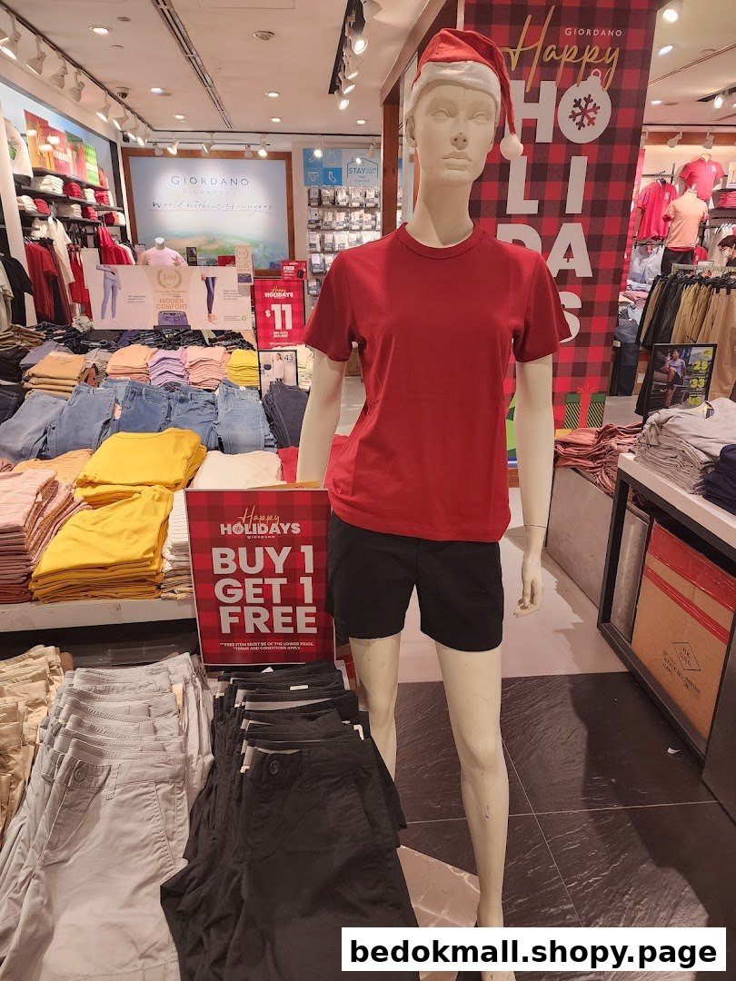 Mannequin and folded clothes inside a Giordano retail store.