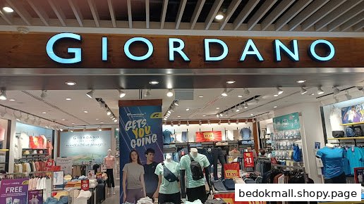 Entrance of a Giordano clothing store with its prominent sign.