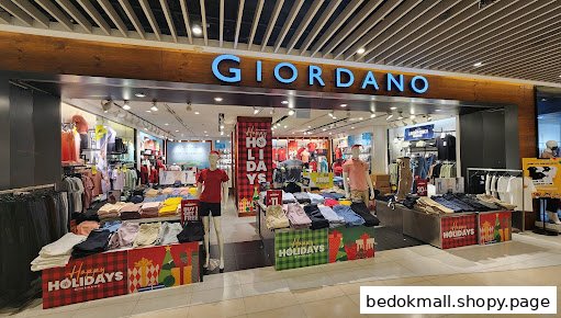 Giordano shop front with clothing displays and holiday decorations.