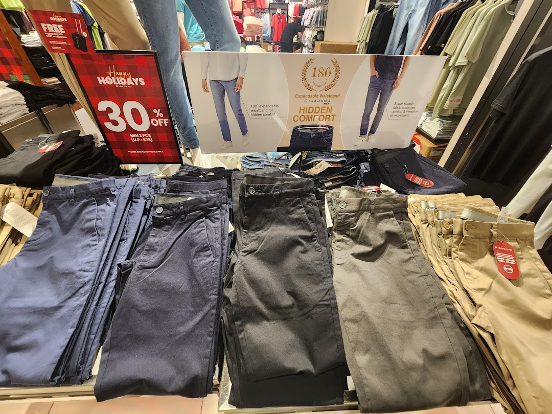 Pants displayed in a retail store with promotional signage.