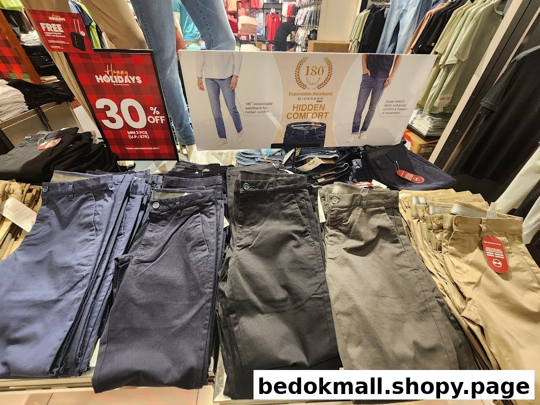 Pants displayed in a retail store with promotional signage.