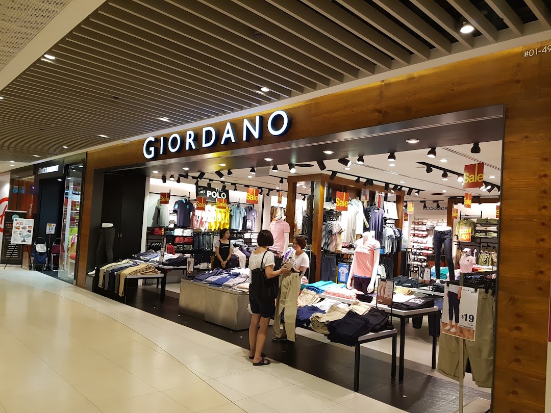 Giordano shop entrance with merchandise and customers visible inside.