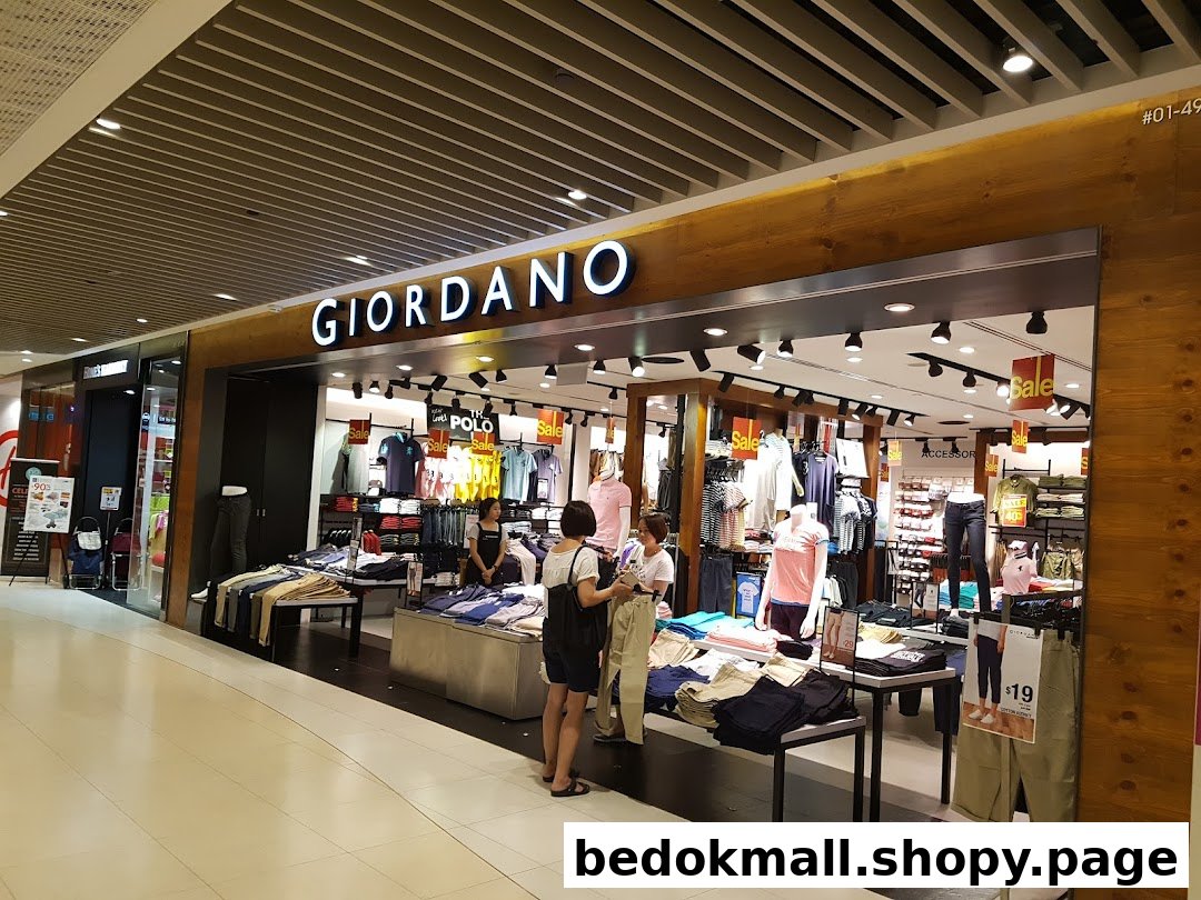 Giordano shop entrance with merchandise and customers visible inside.