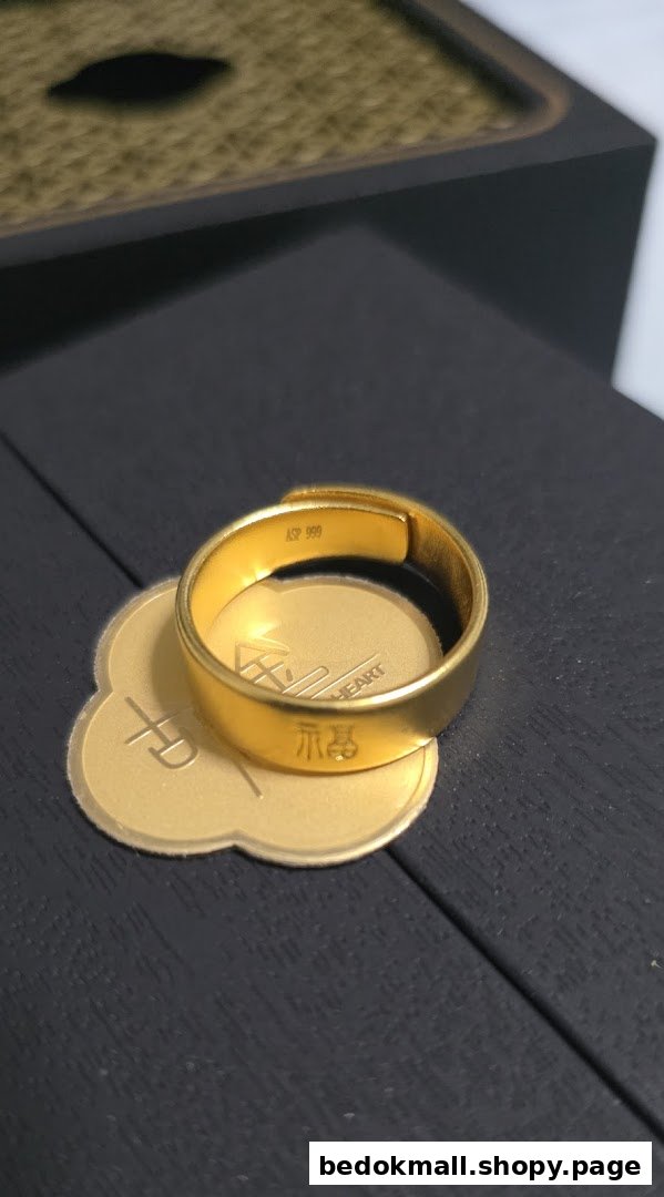 A gold ring with Chinese characters rests on a gold display base.