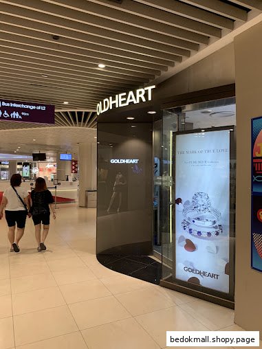 Exterior of Goldheart Jewelry shop with display window and signage.