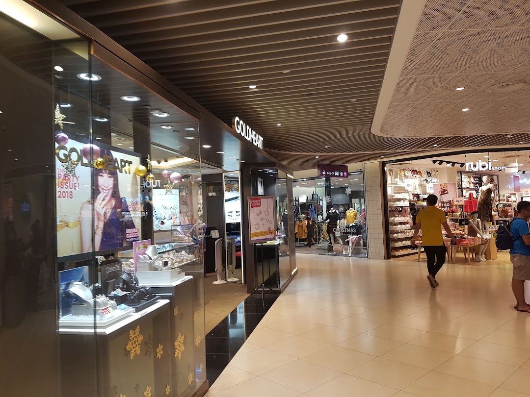 Goldheart Jewelry shop front with displays and mall corridor.