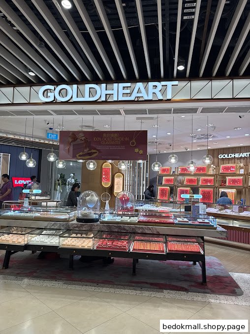 Goldheart Jewelry shop front with display cases and entrance in a mall.