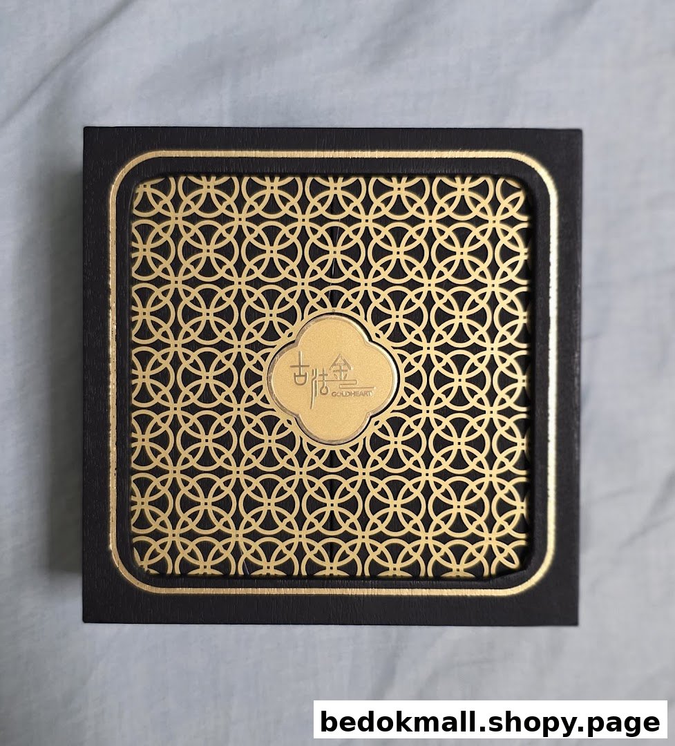 A black box with a gold patterned lid and Goldheart logo.