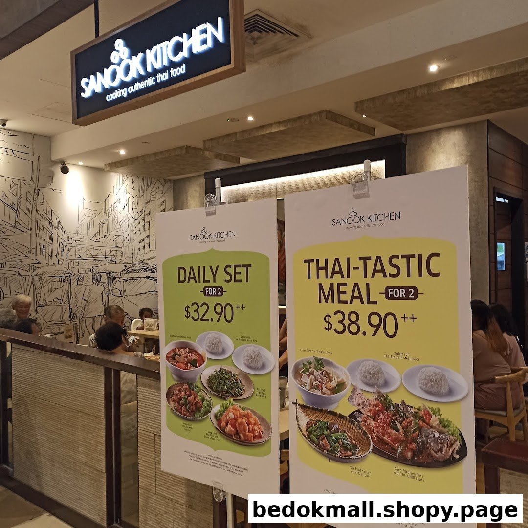 Two large promotional menus for a Thai restaurant with customers inside.