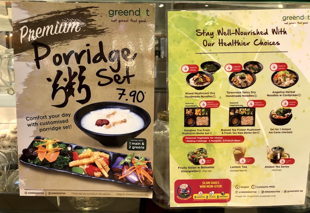 Two large menu boards display food items, prices, and healthy options.
