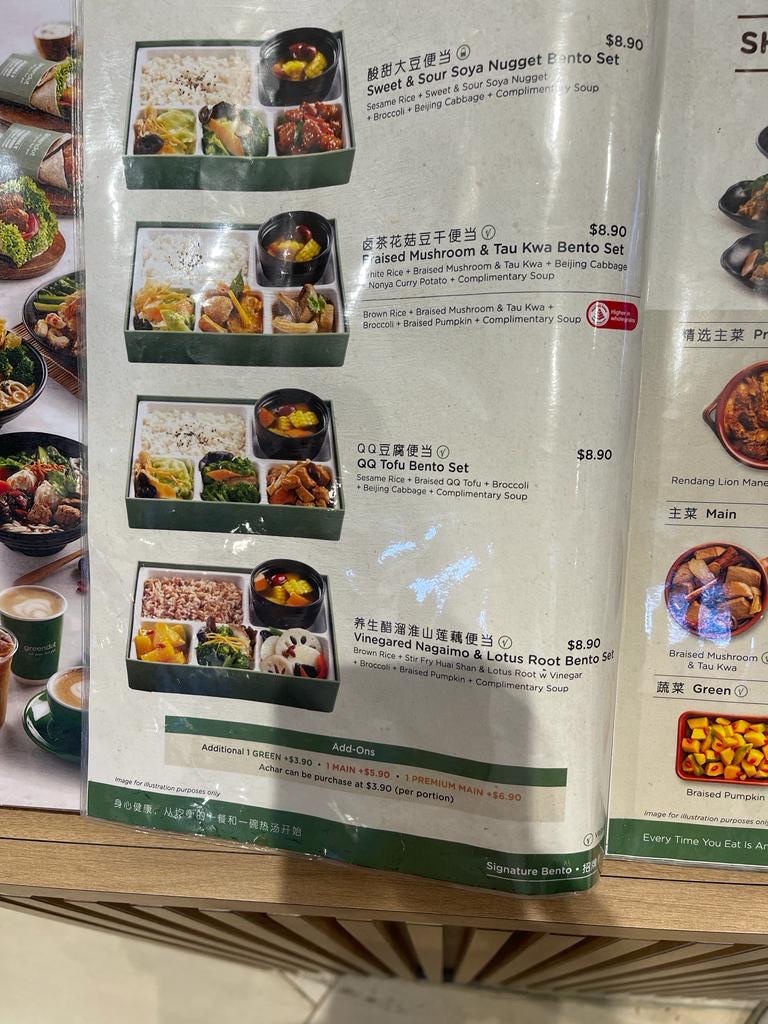 Close-up of a menu displaying various bento sets with prices and descriptions.