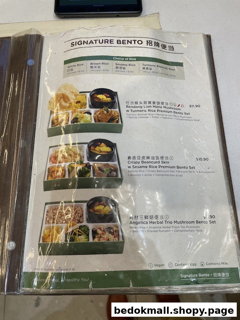 A close-up of a menu displaying various bento sets with prices.