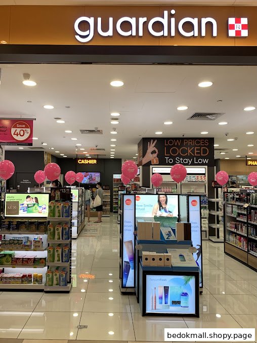 Interior view of a Guardian health and beauty store with products and displays.