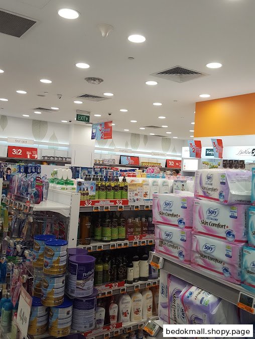 Interior of a health and beauty pharmacy with stocked shelves of various products.