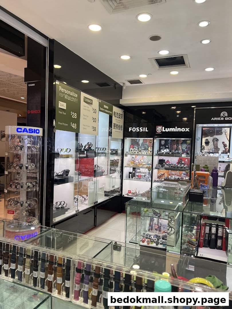 Interior view of a watch shop with multiple display cases and brand signs.