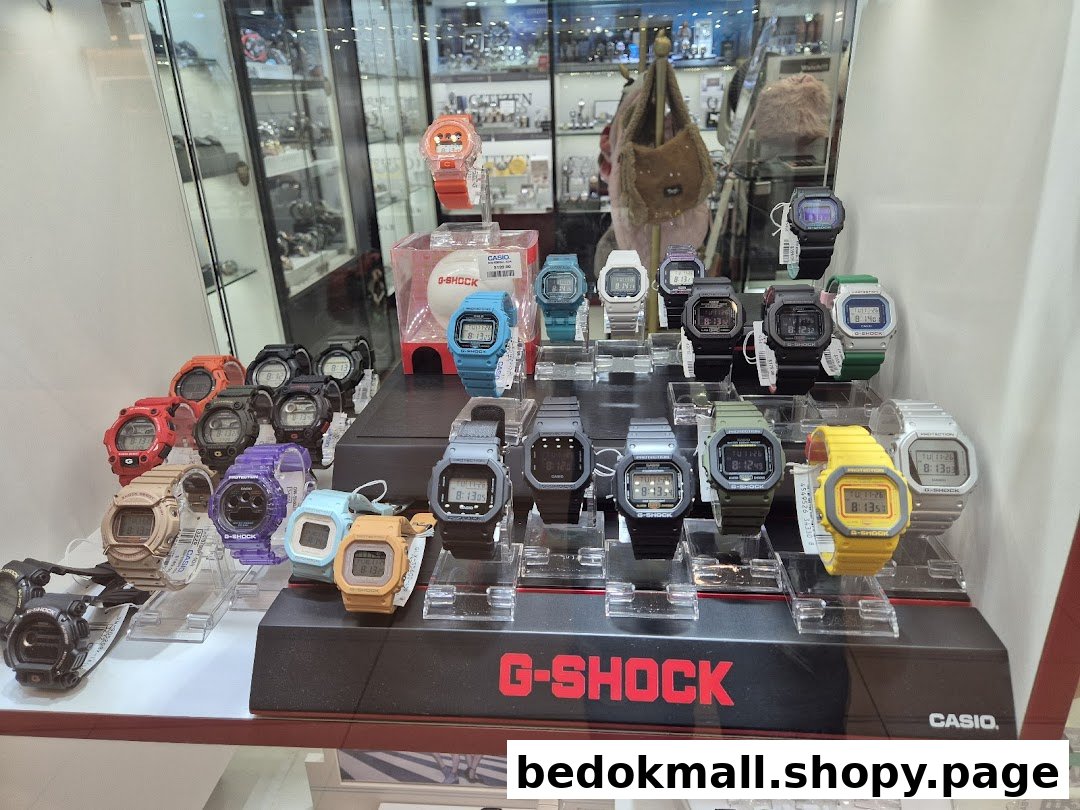 A display of colorful G-Shock watches inside a retail store.