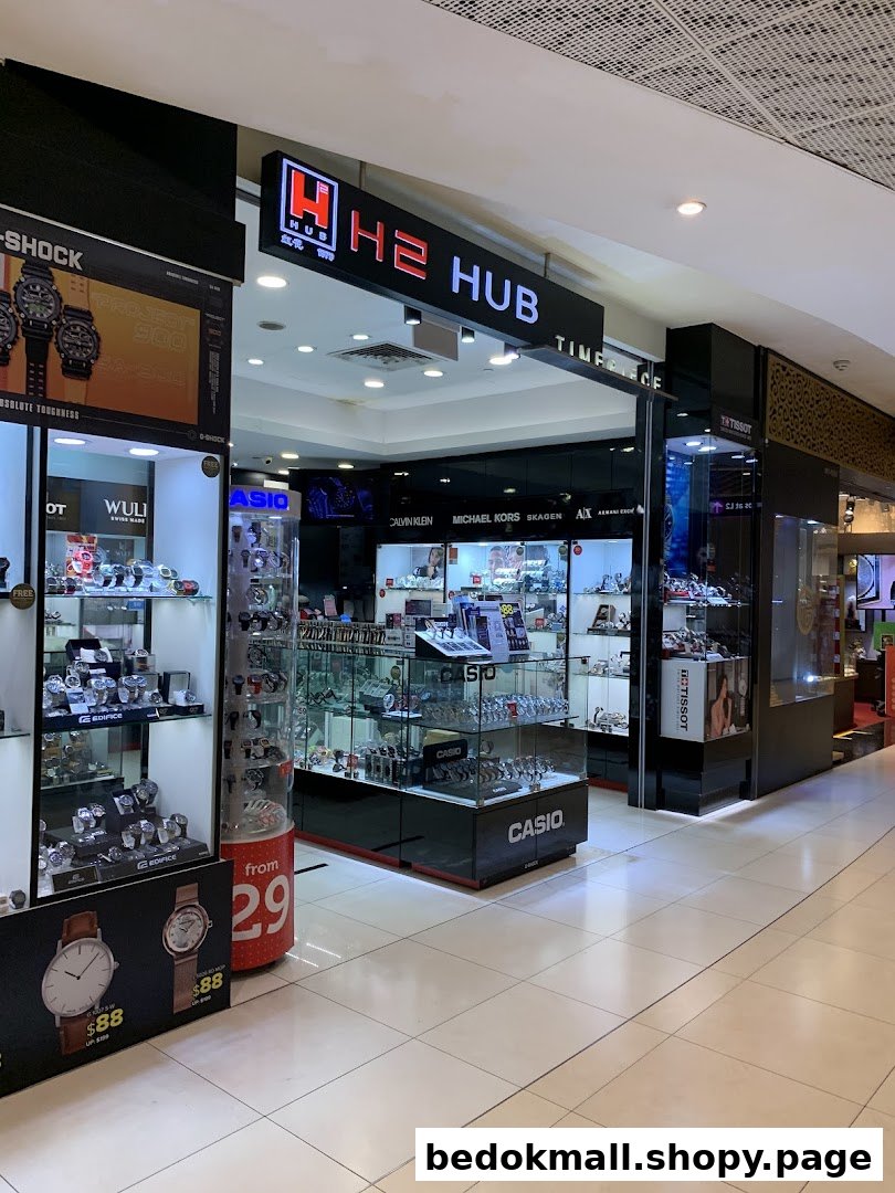 Entrance of H2 Hub watch shop with display cases visible.