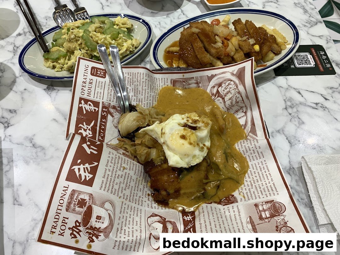 Multiple dishes of food, including a sauced main, served on a marble table.