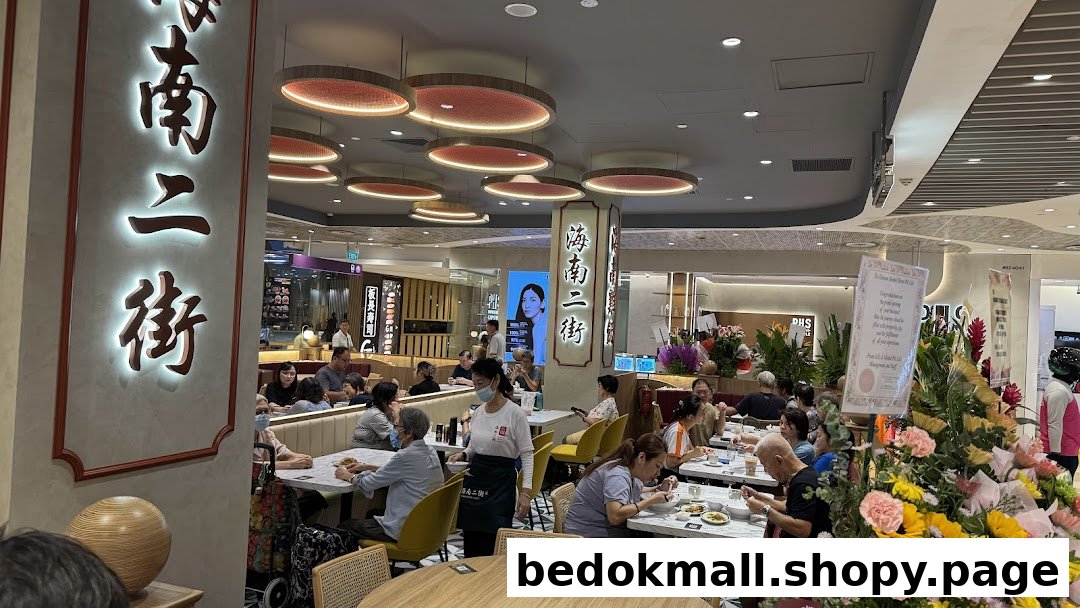Interior view of a busy restaurant with customers dining and staff working.