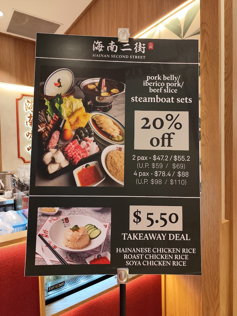 Menu board displaying steamboat and chicken rice deals with prices.