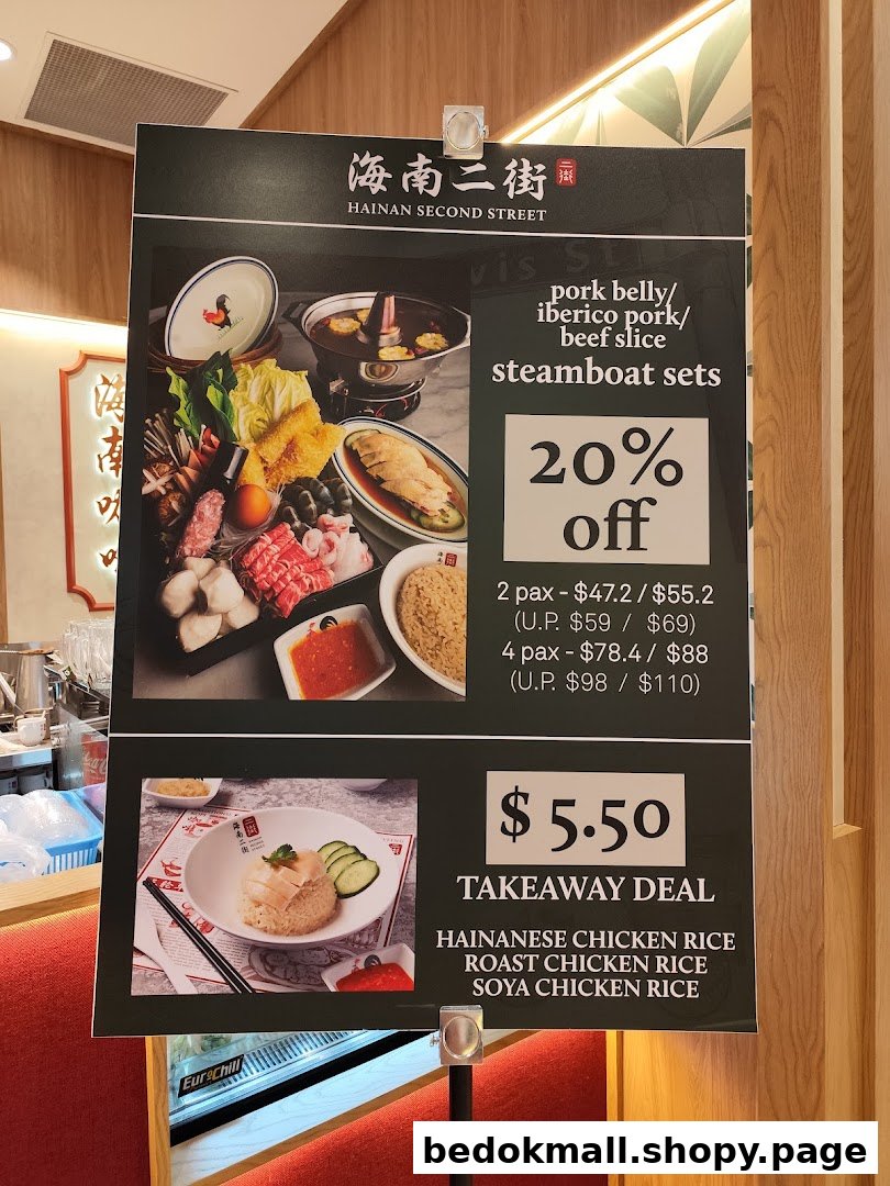 Menu board displaying steamboat and chicken rice deals with prices.