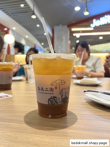 A drink from Hainan Second Street on a table in a restaurant setting.