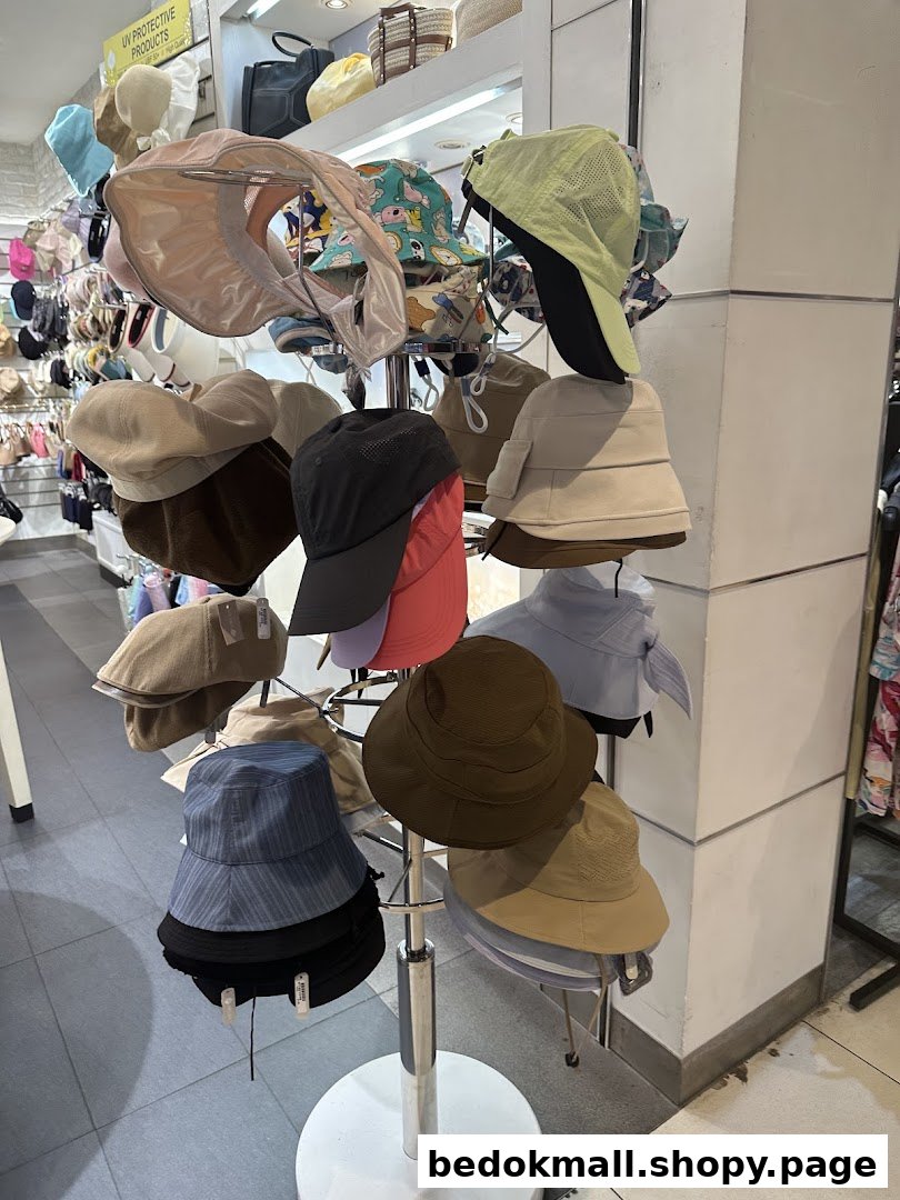 A display stand inside a shop featuring various hats and caps.