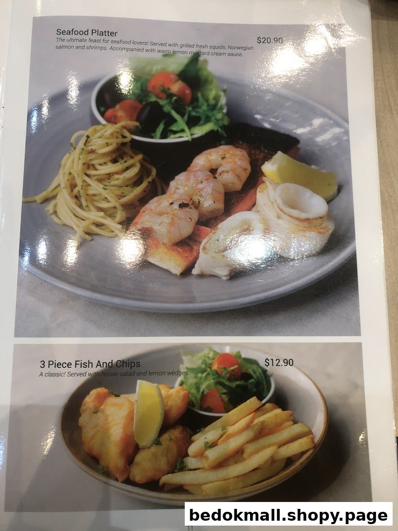Image shows two menu items: Seafood Platter and Fish and Chips with prices.
