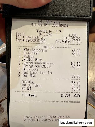 A restaurant bill showing ordered food items, prices, and total amount.