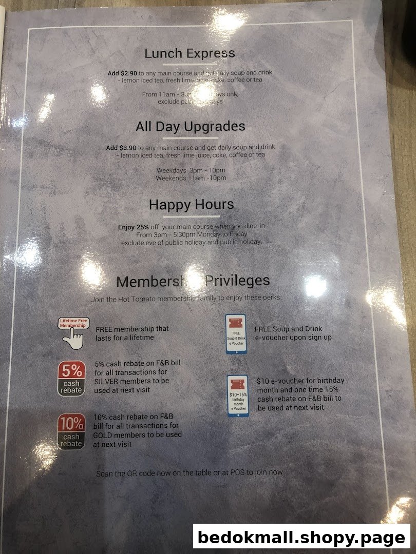 A printed menu displaying lunch specials, upgrades, happy hours, and membership privileges.