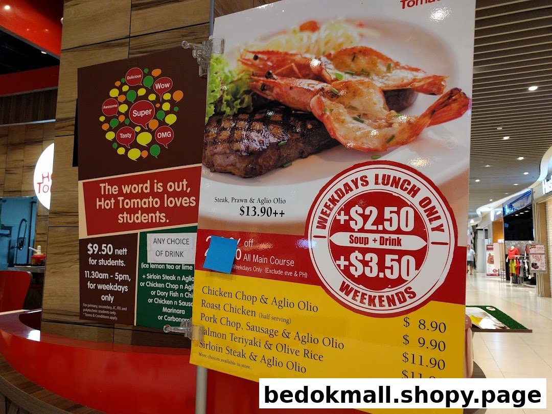 Large promotional signs display food items, prices, and deals for Hot Tomato Bistro.
