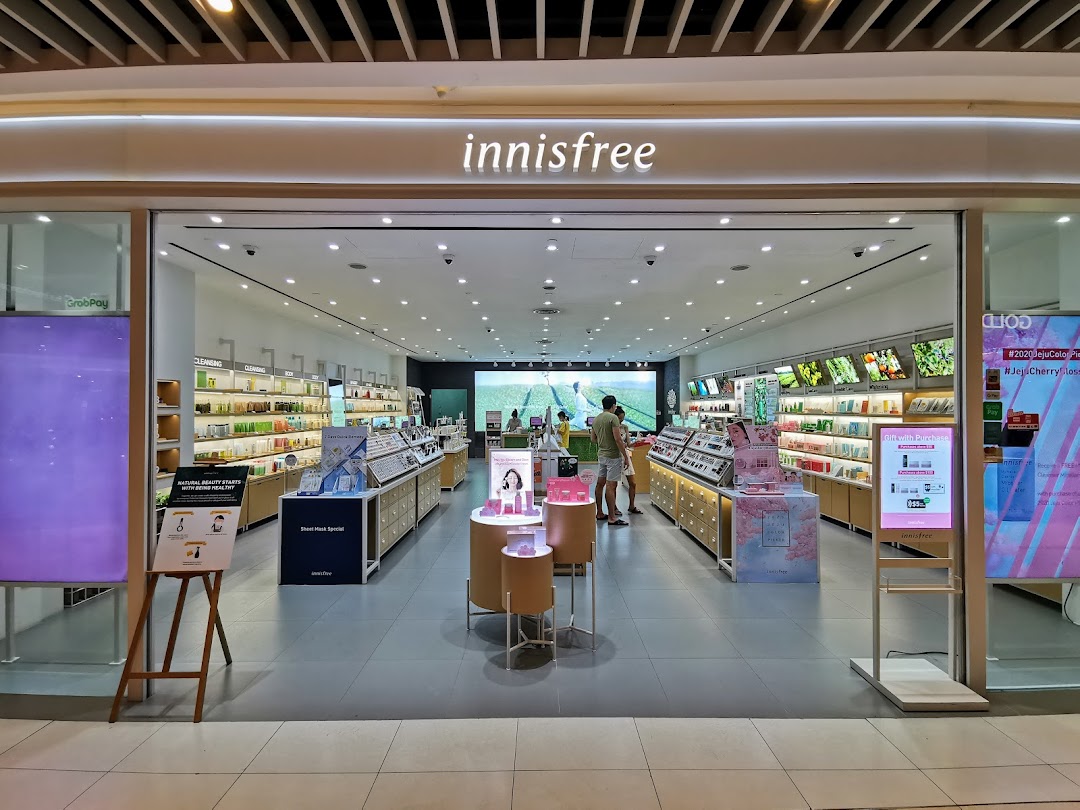 The entrance of an Innisfree beauty store with products displayed inside.
