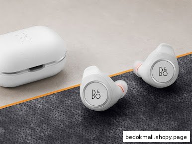 White wireless earbuds and their charging case on a textured surface.