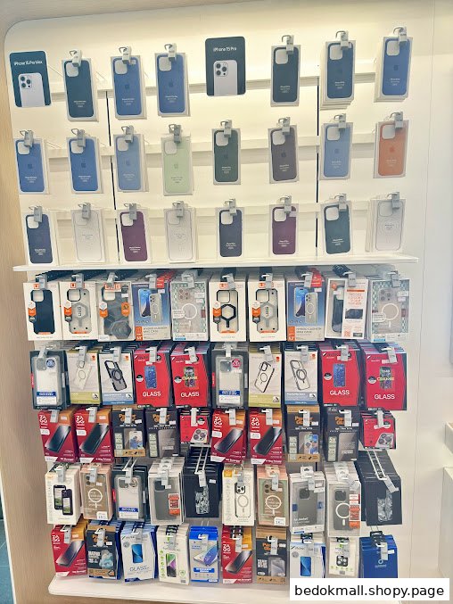 Display wall showcasing various phone cases and accessories in a retail store.